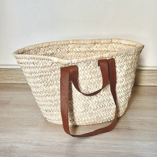 Woven bag with leather handle