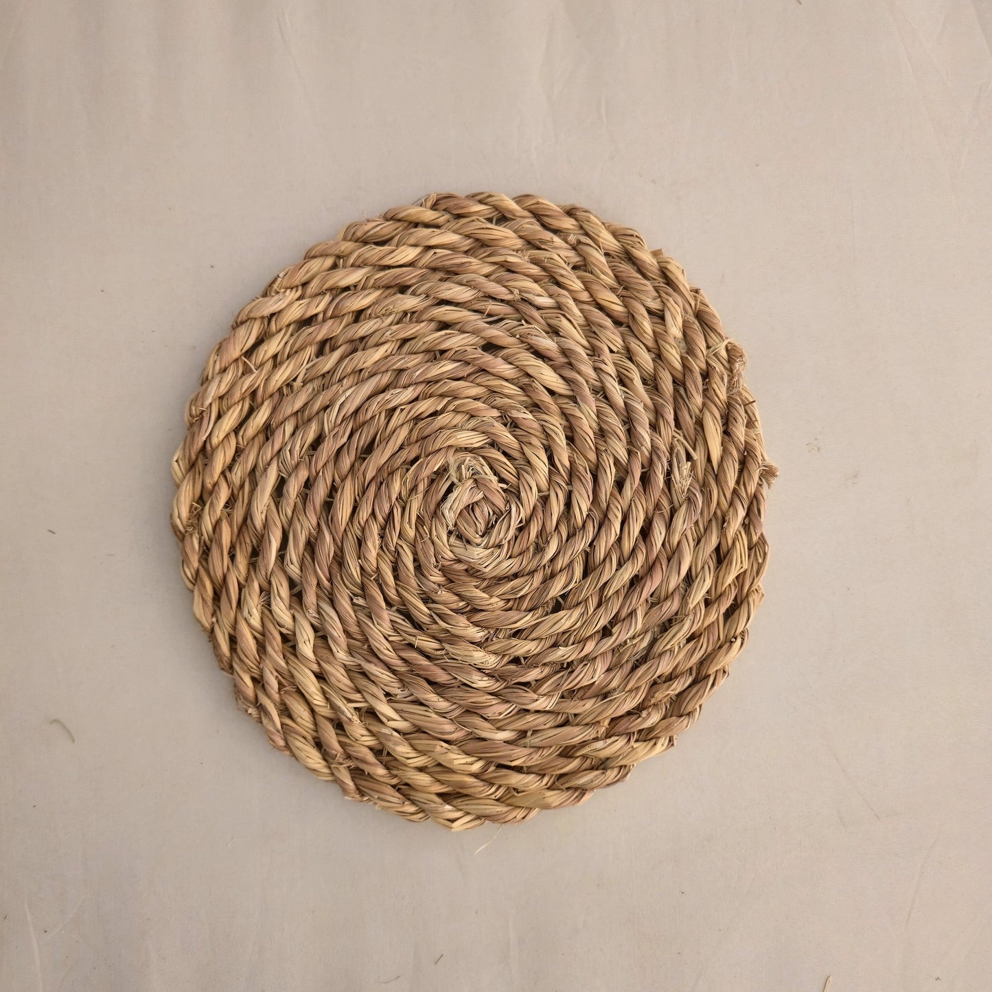 Seagrass spiral placemat by Khoos