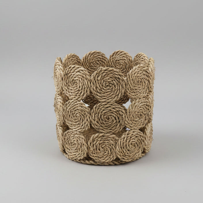 Seagrass rope-rosette basket showing the open rosette construction — Khoos