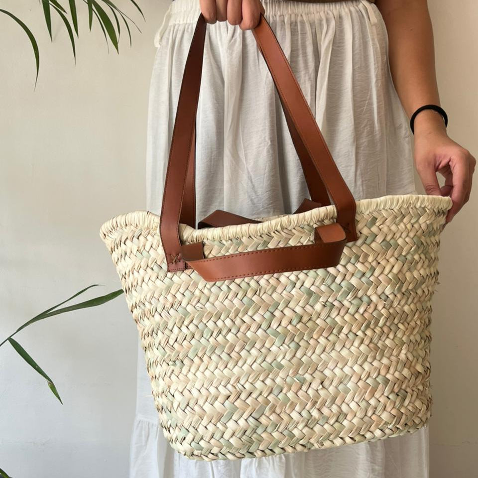 Woven bag with leather handle