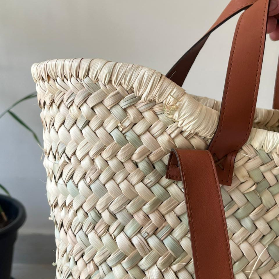 Woven bag with leather handle