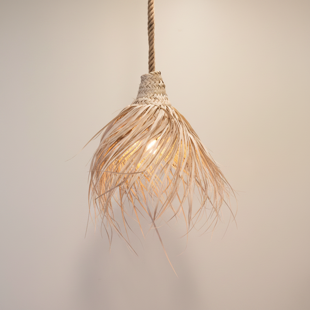 A rustic pendant light with a woven natural fiber shade suspended from a thick rope cord, set against a plain light beige background.
