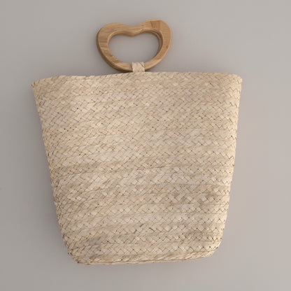 Palm bucket bag with wooden heart handle by Khoos