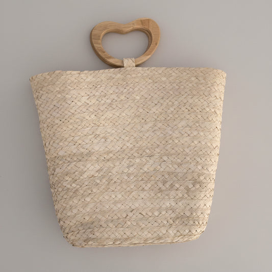 Palm bucket bag with wooden heart handle by Khoos