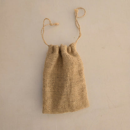 Sorra tiny jute drawstring pouch that covers a phone — Khoos