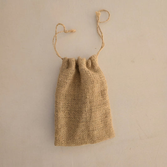 Sorra tiny jute drawstring pouch that covers a phone — Khoos
