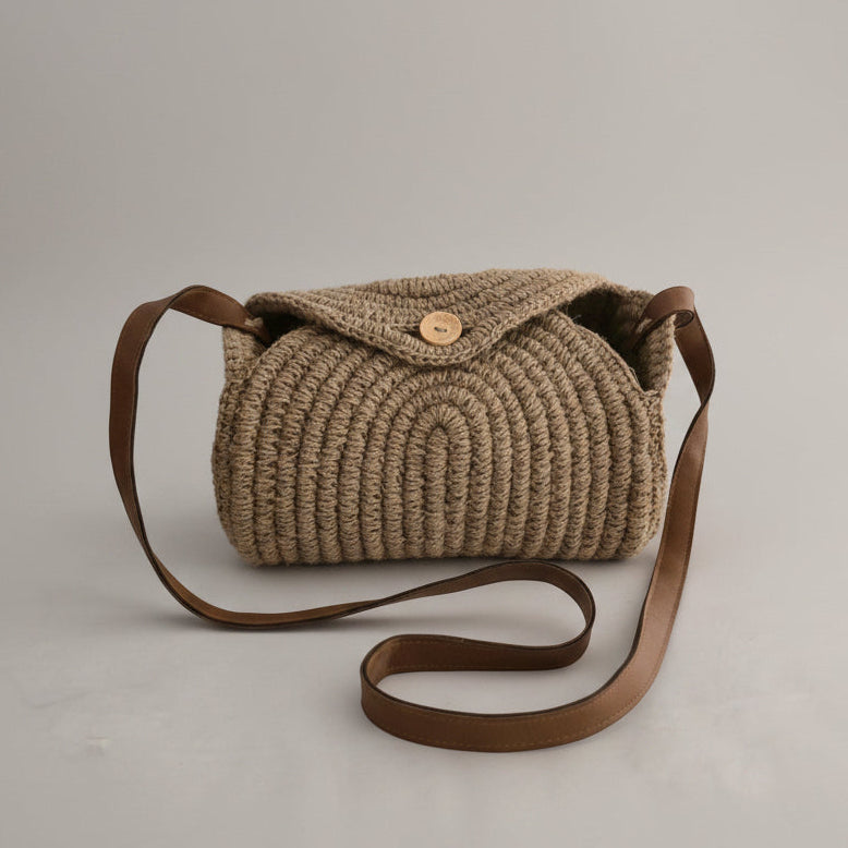 Crochet jute crossbody bag with leather strap by Khoos