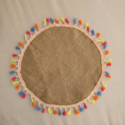 Round jute placemat with colorful tassels by Khoos