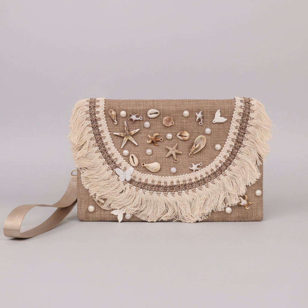 Handwoven seashell-embroidered clutch with cotton fringe by Khoos
