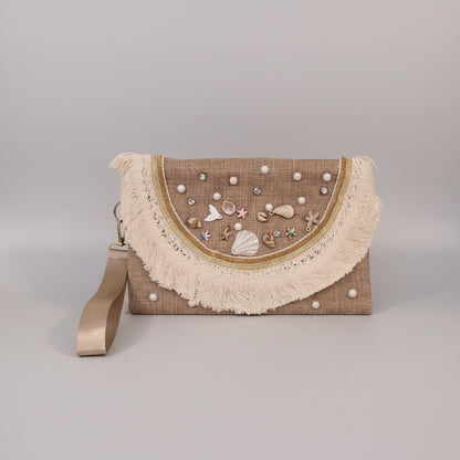Seashell-embroidered clutch, angled view — Khoos