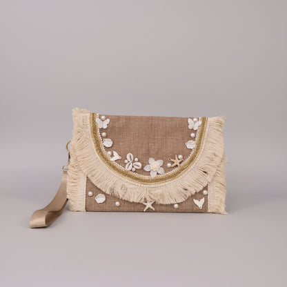 Seashell-embroidered clutch detail — Khoos