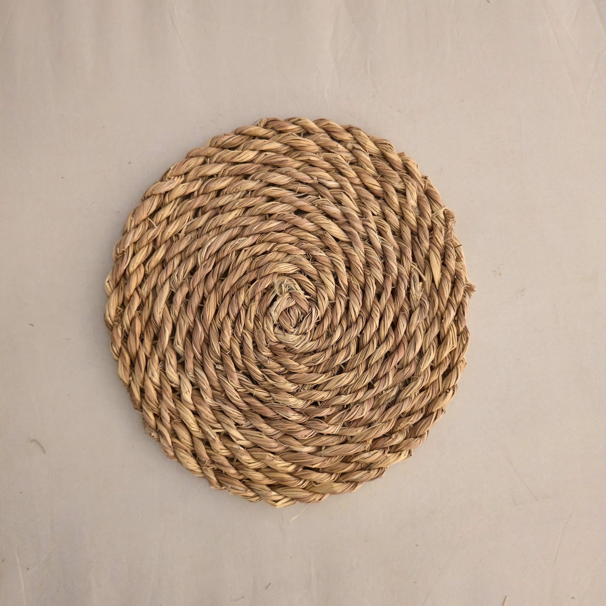 Seagrass spiral placemat by Khoos