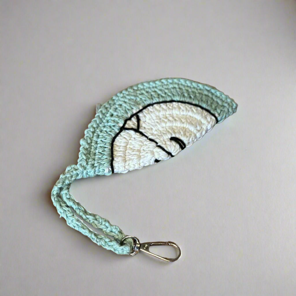 Mint hand-crocheted cotton sunglasses case with a cream centre, wrist strap and clip, 14 cm — Khoos