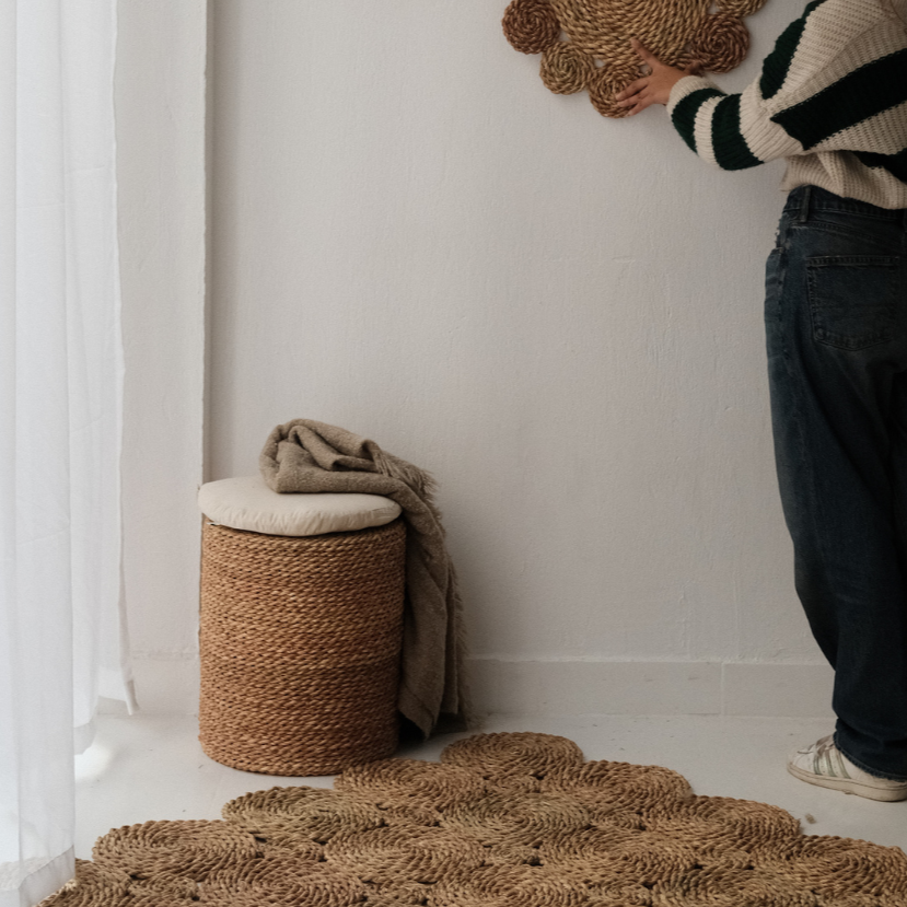 Halfa Rolled Comfort Stool in a sunlit corner beside a woven rug — Khoos