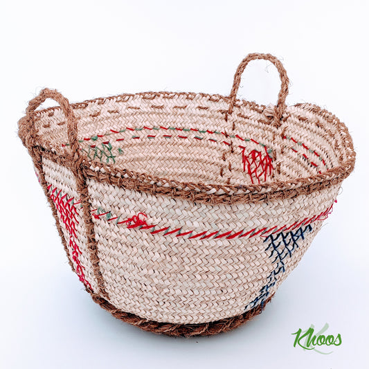 Woven basket with colored strings