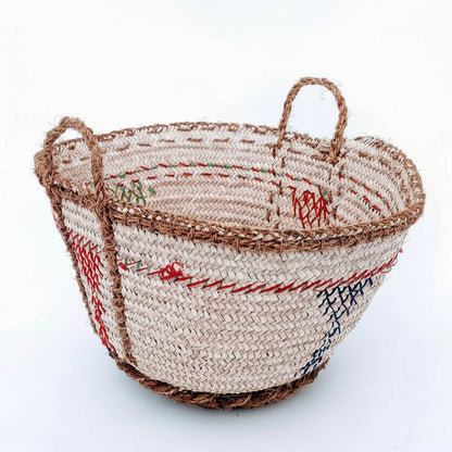 Woven basket with colored strings